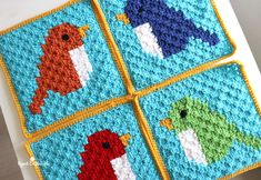 four crocheted squares with different colored birds on them, one is blue and the other is orange