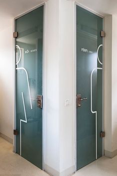 there are two glass doors with the same person drawn on them in different colors and sizes