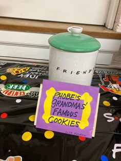 there is a sign on the table that says friends grandma's famous cookies and a cookie jar