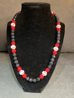 Grab this custom Baseball beaded necklace.  Red black and custom baseball beads, a classic one and only design  20in w/ magnetic clasp for easy and comfort. Elevate your style AND your game with our vibrant, handcrafted beaded necklace.   Look Good, Feel Good, Feel Good Play Good! BLING BLING ⚾️🏈⚽️🏀⚾️️ 📿 Baseball Football Soccer Softball Basketball 🌟 Features Versatile Design 🌟 Unique Design 💎 Quality Matters: Thick Elastic band and magnetic clasps ensure durability and long-lasting wear.  You will not see this band and clasp anywhere else. 📸 Instagram-Ready: Be prepared for compliments and photo ops wherever you go! Follow @DingerCityDrip Black Silver White Cross Beaded Necklace Fruit Loop Phillies Yellow Orange Green Teal Rhinestone Bead Beaded Chain Blue Pink Red Green Baseball W Black Beaded Necklace With Letter And Round Beads, Black Beaded Necklace With Letter Beads, Casual Red Beaded Bracelet For Sports Events, Casual Red Jewelry With Black Beads, Black Necklaces With Round Letter Beads, Red Black And White Beaded Necklace, Red White And Blue Beaded Necklace, Baseball Chain Necklaces, Baseball Necklace