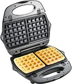 two waffles sitting on top of each other in a pancake maker with the lid open