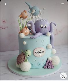 a blue cake with an octopus and sea animals on it