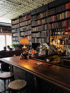 a bar with lots of books on the shelves