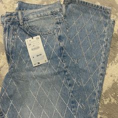 High-Waisted Flare Leg Jeans With Five Pockets. Rhinestone Appliqus That Create Sparkle . Front Zip And Metal Button. Flared Jeans Rhinestone, Zara Glitter Jeans, High Waist Blue Jeans With Rhinestones, Zara Rhinestone Jeans, Denim Blue Rhinestone Straight Leg Jeans, Sparkle Jeans, Rhinestone Jeans, Zara Jeans, High Waisted Flares