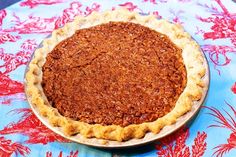 a pie sitting on top of a blue table cloth