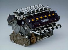 an image of a car engine that is in the process of being built and assembled