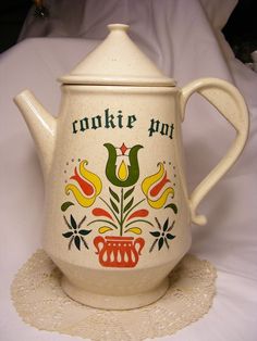 a ceramic teapot with the words cookie pot painted on it