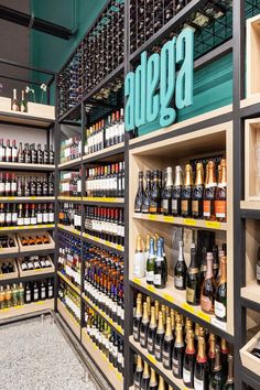 the shelves are filled with many different types of wine