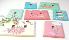 four light switch covers with flowers on them