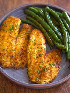 some chicken and green beans on a plate