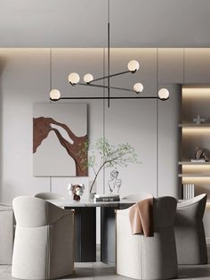 a modern dining room with white chairs and an art work on the wall