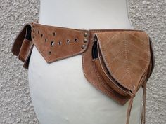 Suede festival utility pocket belt perfect for the dancefloor or travelling.   Light Brown  colour This belt is adjustable from 32-39 inch   (81- 99 cm)    It has 4 pocket which close with zips  Pocket Size Front 2 zip pockets 5 x 4 inch (12 x 10 cm) 1 zip pocket   7 x 4 inch  (18 x 10 cm)   fits all mobile phones Back (secret hidden pocket) 1 zip pocket 6 x 4 inch    (16 x 10 cm) Comes in a unique gift bag . Pocket Belt , Fanny pack , burning man , leather belt , hippie belt Hippie Belt, Light Brown Colour, Festival Belt, Bag Pocket, Utility Belt, All Mobile Phones, Brown Colour, Phone Pouch, Pocket Belt