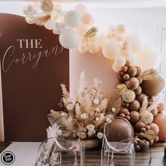 balloons and decorations on a table for a wedding