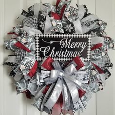 a christmas wreath hanging on the front door