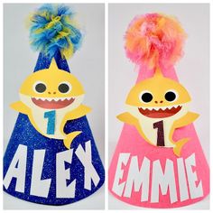 two paper hats that say alexy and the other one has a shark on it