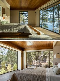 this bedroom has wood paneling and large windows that look out onto the lake below