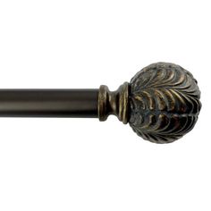 an antique style curtain rod with a decorative design on the top and bottom, in bronze