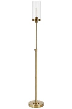 a gold floor lamp with a clear glass shade on the base and a metal stand