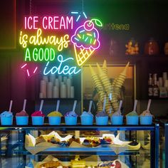 ice cream is always a good idea neon sign above display case filled with desserts