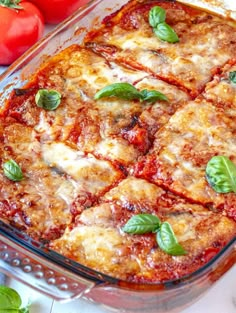 a casserole dish is shown with tomatoes and basil