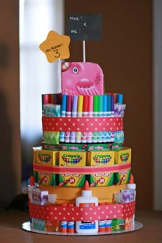 a cake made to look like a stack of crayons