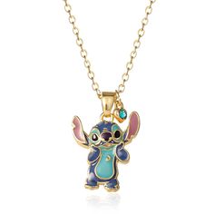 a necklace with an adorable little baby stitchie charm on it's side and a gold chain