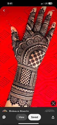 the hand is decorated with intricate designs