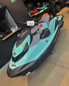 a blue and black jet ski is on display