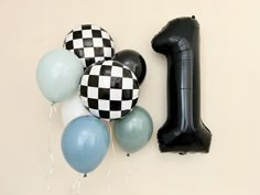 balloons and an inflatable balloon are arranged on the wall next to each other