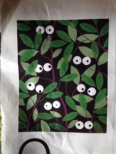 an image of leaves and eyes on a black background with white circles in the middle