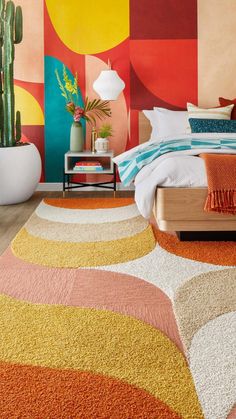 a bedroom with colorful walls and rugs on the floor, potted plants next to the bed