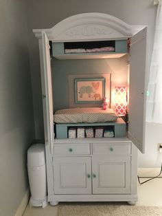 an image of a baby crib in the corner of a room that is on sale