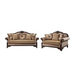 two couches sitting next to each other on a white background