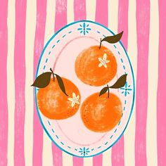 three oranges on a plate with pink and white stripes in the back ground,