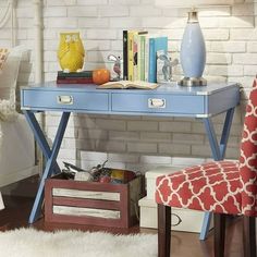 a blue desk with two drawers and an orange chair