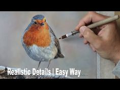 a hand holding a pencil and drawing a bird on a piece of paper with the words realistic details easy way