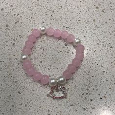 This Hello Kitty Pearl Bracelet In Pink Is A Must-Have Accessory For Any Fan Of The Beloved Character. The Bracelet Features Charming And Beaded Details, With A Touch Of Elegance Added By The Pearl Stones. The Hello Kitty Branding Is Prominently Displayed, Making It A Perfect Addition To Any Jewelry Collection. The Bracelet Is Brand New And Has Never Been Worn, Making It A Great Gift Option For Any Occasion. The Color Pink Adds A Playful Touch To The Bracelet, And The Beaded Design Makes It Suit Cute Hello Kitty Bracelet, Beaded Bracelet With Charm, Beaded Bracelets Pink, Pearl Bracelet Ideas, Hello Kitty Bracelets, Bracelet Hello Kitty, Jewelry Hello Kitty, Bracelet With Pearls