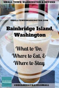 a drink sitting on top of a table in front of a sign that reads, cambridge island, washington what to do, where to eat & where to stay