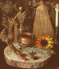 a wooden table topped with lots of different types of items on top of each other