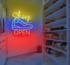 a neon sign that says shoes are open in front of a closet full of shoes