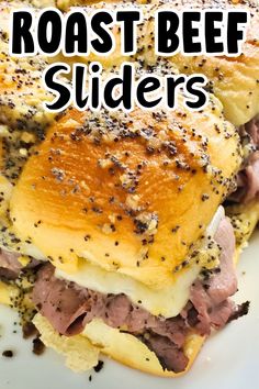 roast beef sliders on a white plate with black pepper sprinkled on top