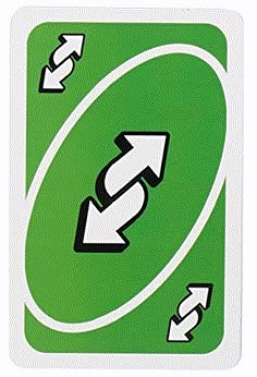 a green and white sticker with arrows pointing in different directions on the back of it