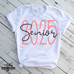 a white shirt with the word senior printed in black and orange on it's chest