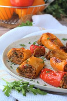 some stuffed peppers are on a white plate