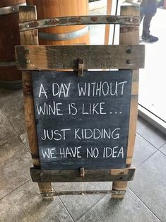 a sign that says a day without wine is like just kidding we have no idea