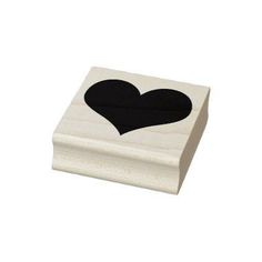 a wooden box with a black heart on it