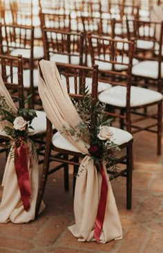 the chairs are decorated with flowers and ribbons