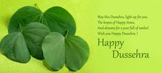 two green leaves with the words happy dussehera on them are placed next to each other