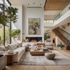 a living room filled with lots of furniture and a fire place in the middle of it