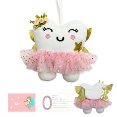 a tooth fairy ornament with a pink tutu skirt and gold tiara